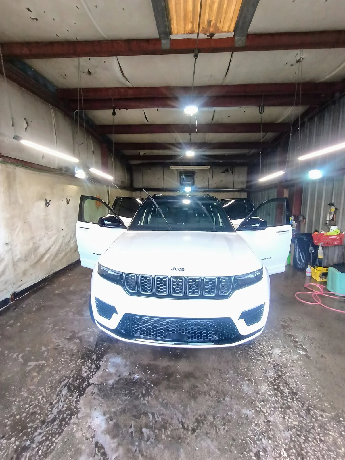 White Jeep receiving exterior care at the BoPeeps shop